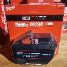 Load image into Gallery viewer, Milwaukee M18 RedLithium Forge battery on a wooden surface with packaging in the background.