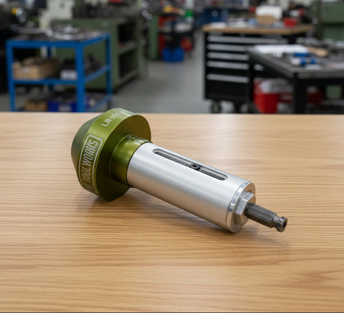 A silver and green cable stripper tool with a label reading 'LR100 1000al 17kv'.