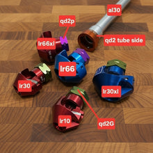 Load image into Gallery viewer, Colorful mechanical components on a wooden surface with labels indicating specifications.
